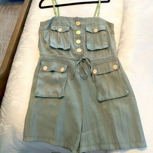 Mint green shorts romper .